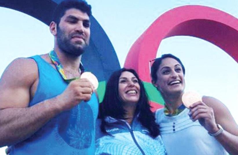ISRAELI JUDKOAS Yarden Gerbi (right) and Ori Sasson (left), posing with Culture and Sport Minister Miri Regev, won the blue-and-white’s lone medals at the Rio Olympics which came to a close on Sunday night. (photo credit: Courtesy)