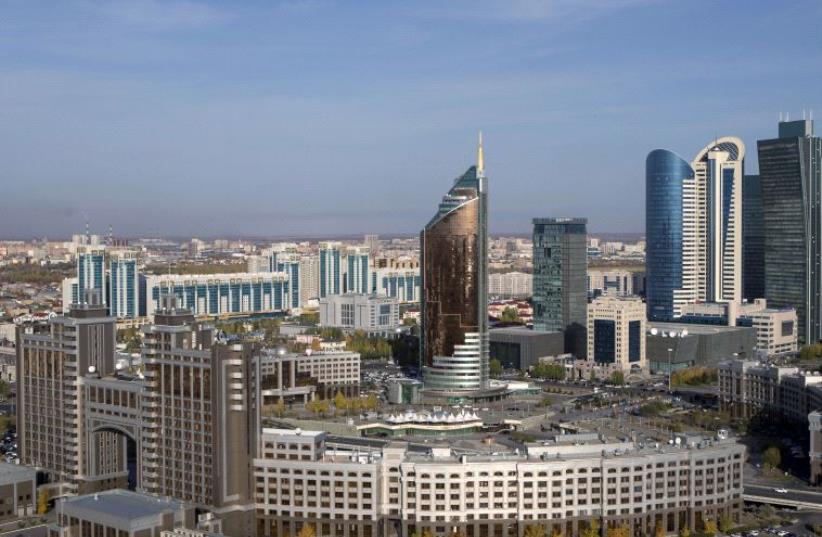 A general view of downtown with Kazakhstan's national oil company KazMunayGas (KMG) headquarters (front) in Astana, Kazakhstan. (photo credit: REUTERS)