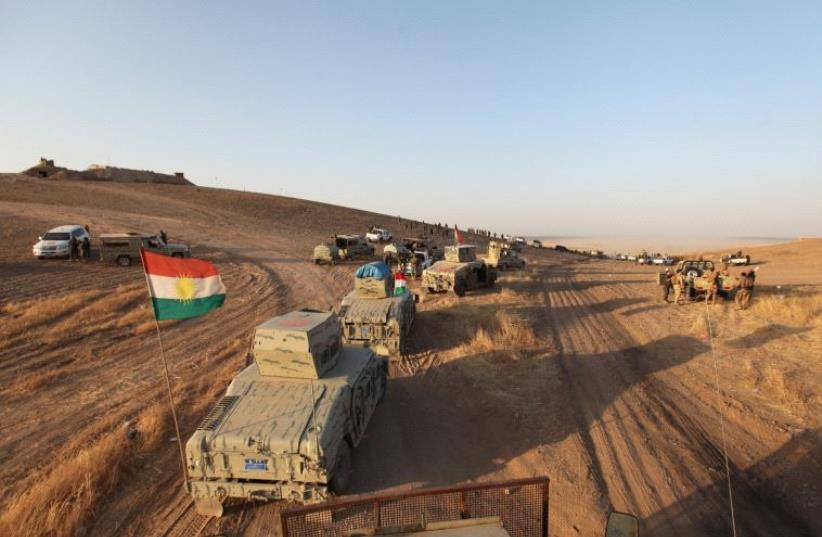 Kurdish Peshmerga forces are seen southeast of Mosul, August 14 (photo credit: REUTERS)
