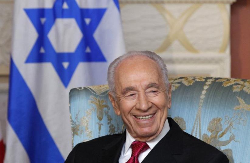 Shimon Peres takes part in a meeting in Ottawa, May 2012 (photo credit: REUTERS)