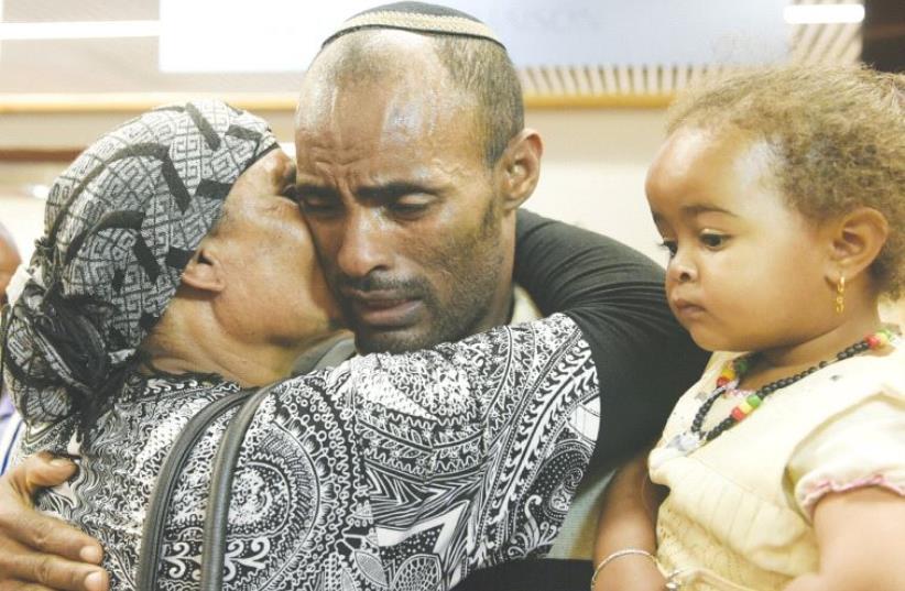 ETHIOPIAN IMMIGRANTS are greeted by loved ones at Ben-Gurion Airport. (photo credit: AVI HAYOUN)