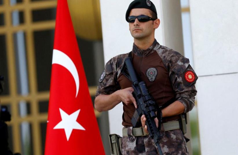 A Turkish special forces police officer guards the entrance of the Presidential Palace in Ankara, Turkey, August 5, 2016 (photo credit: REUTERS)