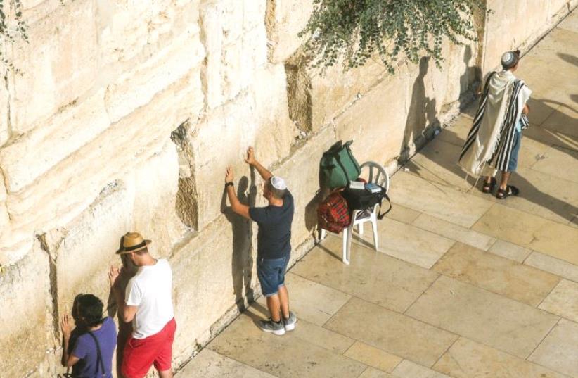 Praying at the Western Wall (photo credit: MARC ISRAEL SELLEM)