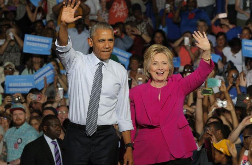 Barack Obama and Hillary Clinton at a campaign event (photo credit: REUTERS)