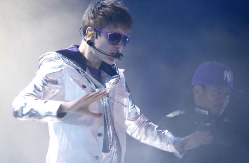 Justin Bieber performing during his 2011 concert in Tel Aviv (photo credit: REUTERS)