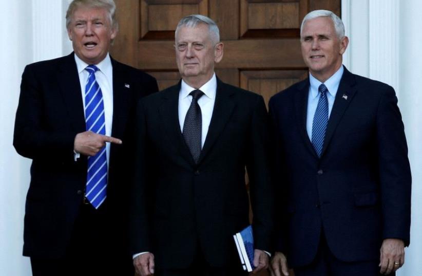 US President-elect Donald Trump (L) and Vice President-elect Mike Pence (R) greet retired Marine General James Mattis in Bedminster, New Jersey, US, (photo credit: REUTERS)