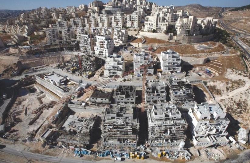 HOUSES UNDER construction in the Har Homa neighborhood of Jerusalem in 2010 (photo credit: REUTERS)