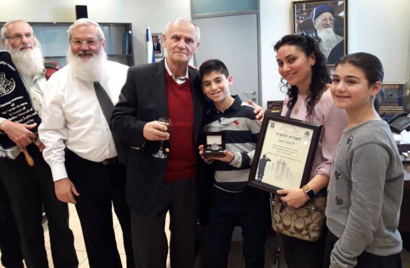 IDF Chief Rabbi Eyal Karim, Deputy Defense Minister Eli Ben-Dahan, grandfather Yisrael Rutner, bar mitzva boy Yehoshua Lebowicz, mother Dr Daniella Rutner and sister Mia Lebowicz (photo credit: TAMARA ZIEVE)