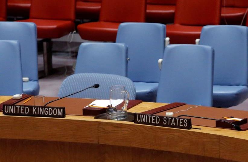 The seats of Britain and the United States sit empty in the United Nations Security Council chamber. (photo credit: REUTERS)