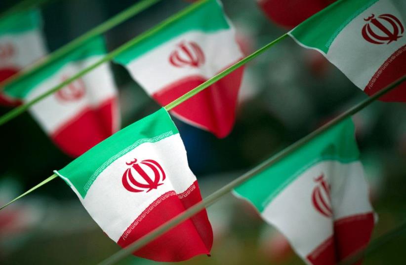 Iran's national flags are seen on a square in Tehran, Iran. (photo credit: REUTERS)