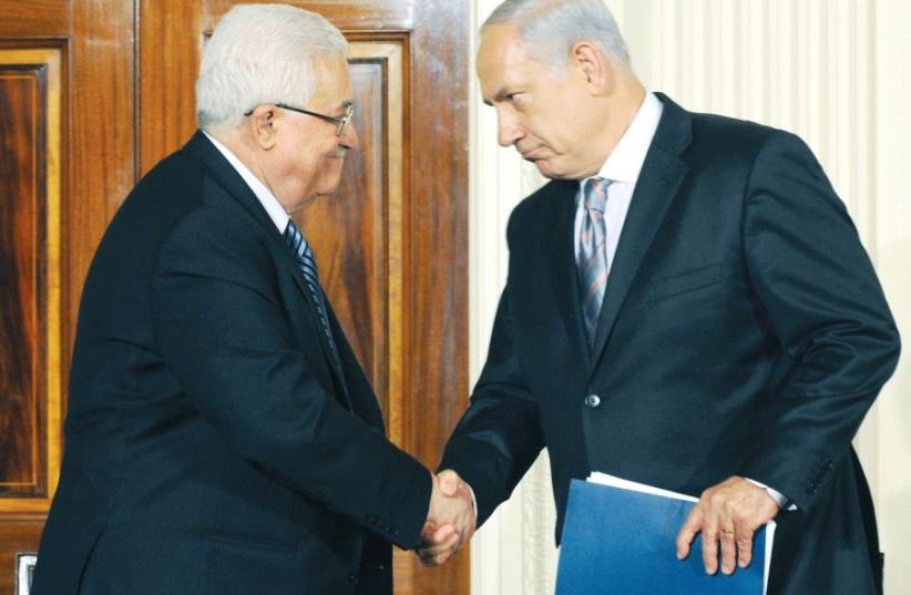 PM Netanyahu and President of the Palestinian Authority Mahmoud Abbas in Washington, 2010 (photo credit: GPO)