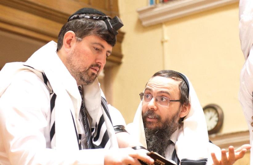 Former far-right politician Csanád Szegedi at prayer with Rabbi Baruch Oberlander, head of Chabad’s mission in Budapest (photo credit: COURTESY / AJH FILMS)