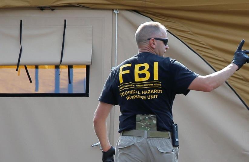 An FBI investigator  (photo credit: REUTERS)