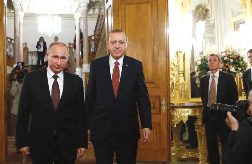 RUSSIAN PRESIDENT Vladimir Putin and his Turkish counterpart Tayyip Erdogan arrive for a joint news conference following their meeting in Istanbul, Turkey, last year. (photo credit: REUTERS)