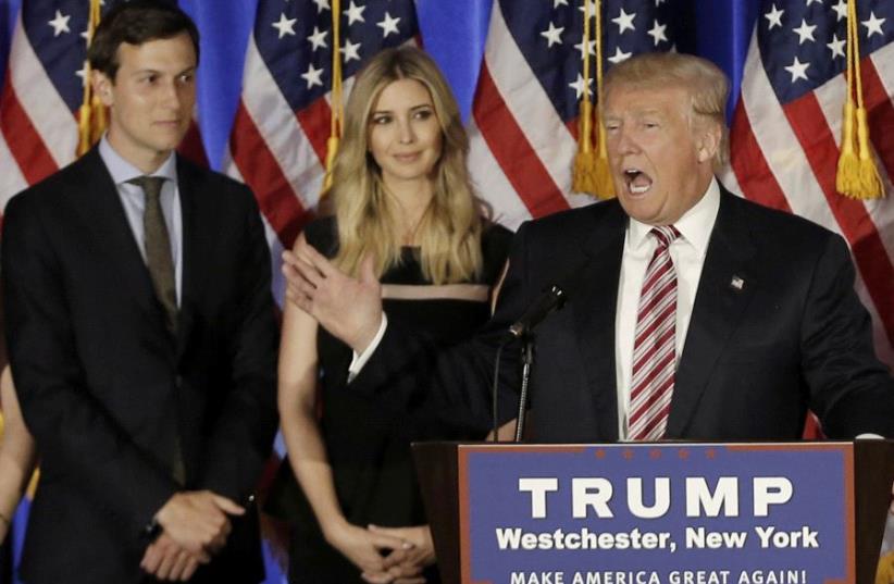 Donald Trump speaks as his son-in-law Jared Kushner and his daughter Ivanka listen. (photo credit: REUTERS)