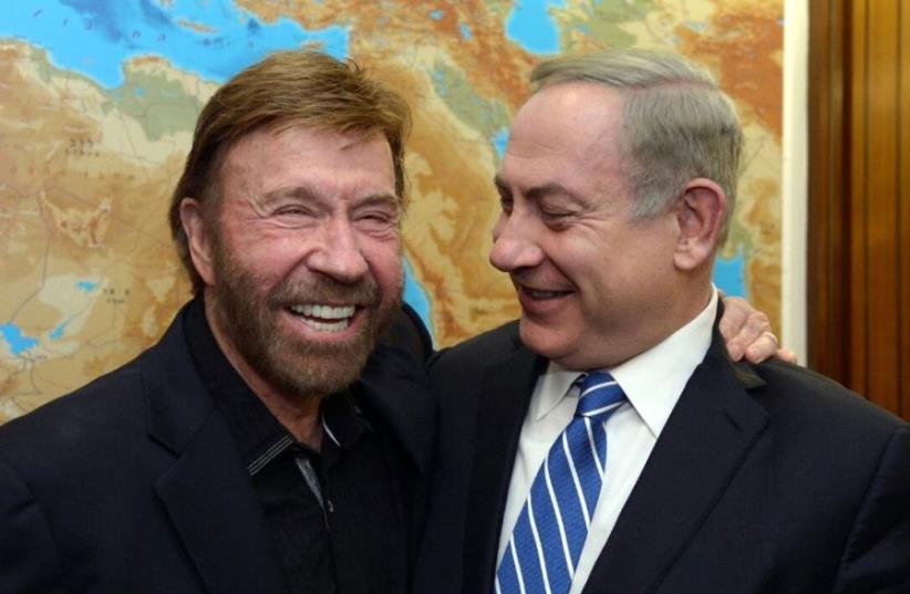 Benjamin Netanyahu and Chuck Norris  (photo credit: CHAIM TZACH/GPO)