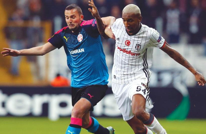 Despite Hapoel Beersheba and Ben Sahar’s (left) best efforts, the Israeli champion was knocked out in the Europa League round of 32 last night, losing 2-1 to Besiktas and Talisca (right) in Istanbul for a 5-2 aggregate defeat. (photo credit: REUTERS)