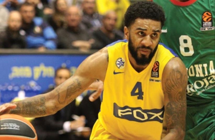 Maccabi Tel Av iv guard D.J. Seeley is set to be handed a bigger role than usual against Olympiacos in Euroleague action tonight, with the yellow-andblue having just eight fit senior players (photo credit: ADI AVISHAI)
