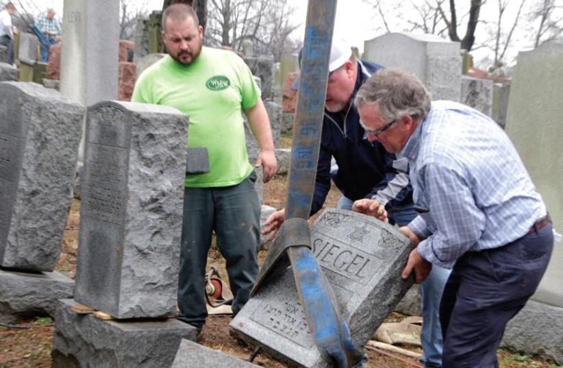 Toppled Jewish headstones after a weekend vandalism attack on Chesed Shel Emeth Cemetery in University City, a suburb of St Louis, Missouri (photo credit: REUTERS)