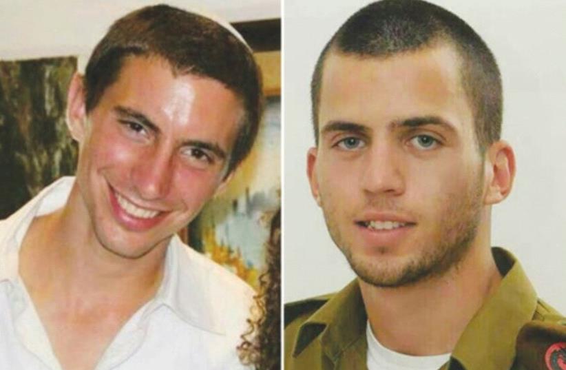 Lt. Hadar Goldin (left) and St.-Sgt. Oron Shaul were killed in action in the war against Hamas in 2014 (photo credit: Courtesy)
