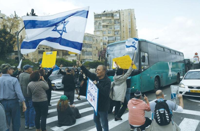 ISRAEL BROADCASTING AUTHORITY employees block the street during a protest against the Histadrut labor federation in Jerusalem yesterday. (photo credit: REUTERS)