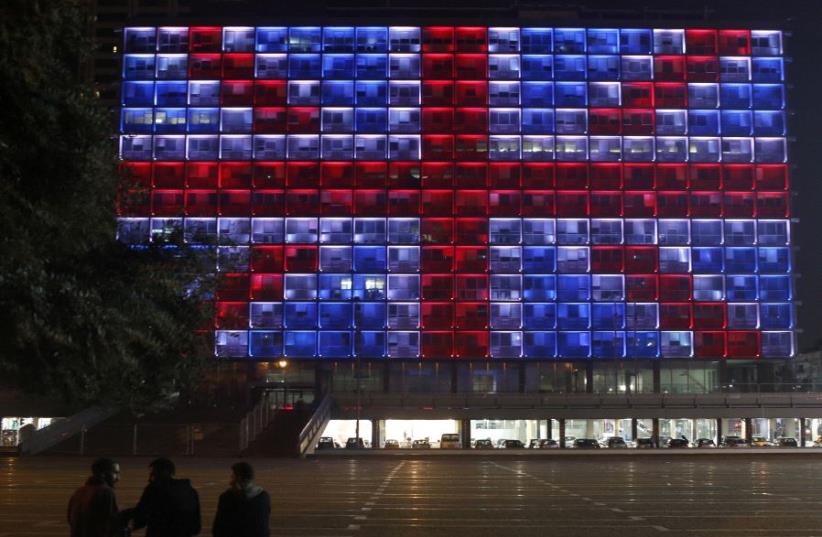The building of the city hall in Tel Aviv's Rabin square in Israel is illuminated in solidarity with Britain for the attack on Westminster Bridge in London March 22, 2017 (photo credit: REUTERS)