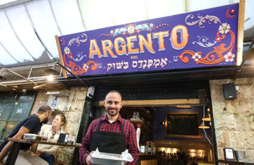 Lucas Zitrinovich in front of Argento, which specializes in empanadas (photo credit: MARC ISRAEL SELLEM)