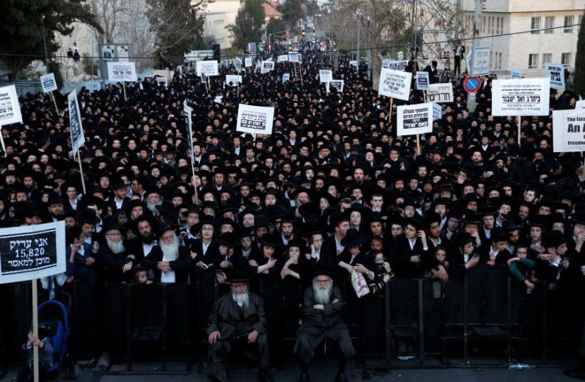 Ultra-Orthodox Jewish protesters take part in a demonstration against members of their community serving in the Israeli army, in Jerusalem (photo credit: REUTERS)