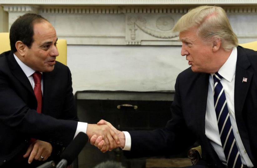 US President Donald Trump shakes hands with Egyptian President Abdel Fattah al-Sisi in the Oval Office of the White House in Washington, US, April 3, 2017. (photo credit: REUTERS)