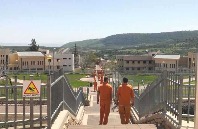INMATES WALK through the Hermon Prison in northern Israel last week. (photo credit: ELIYAHU KAMISHER)