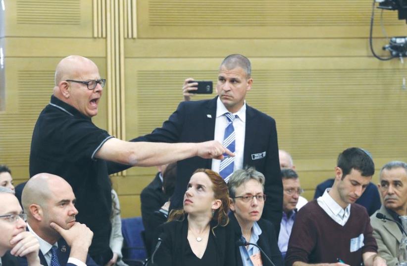 BEREAVED FATHER Ilan Sagi reacts at the Knesset State Control Committee meeting during a discussion about the Operation Protective Edge report yesterday. (photo credit: MARC ISRAEL SELLEM)