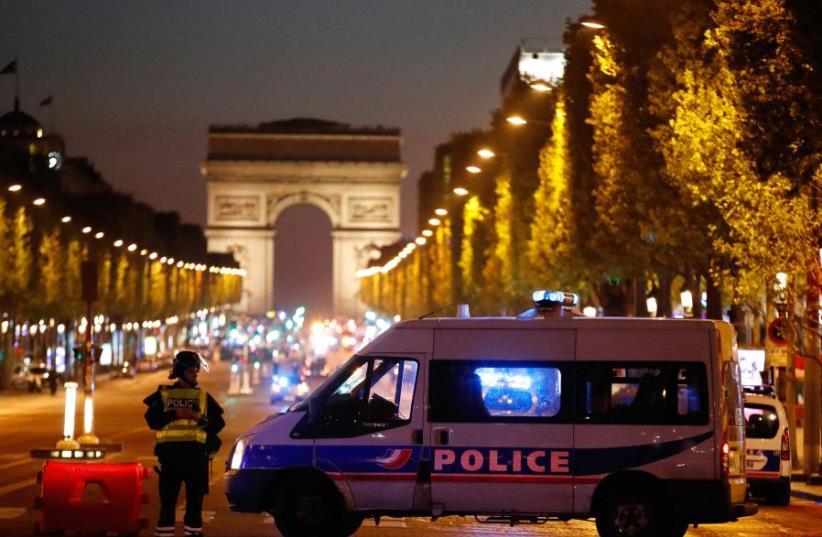 Police secure the Champs Elysees Avenue after one policeman was killed and another wounded in a shooting incident in Paris, France, April 20, 2017 (photo credit: REUTERS)