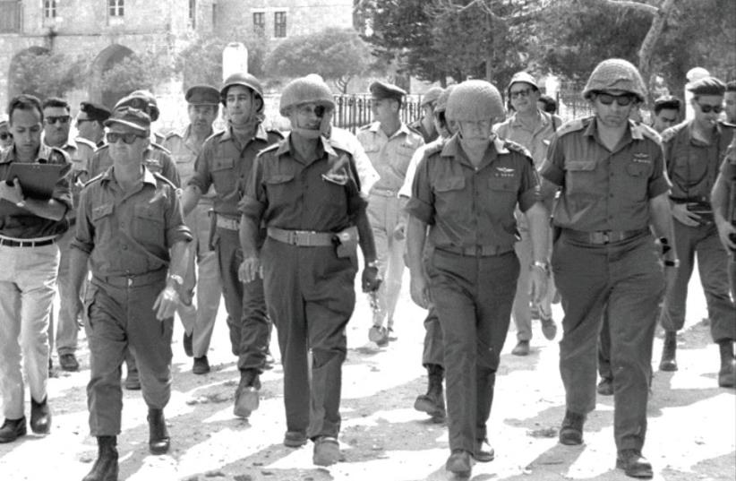 Defense minister Moshe Dayan and chief of staff Yitzhak Rabin (second right) in the Old City of Jerusalem, June 7, 1967 (photo credit: GPO)