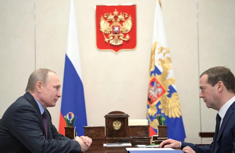 RUSSIA’S PRESIDENT Vladimir Putin meets with Prime Minister Dmitry Medvedev at the Novo-Ogaryovo state residence outside Moscow. (photo credit: REUTERS)