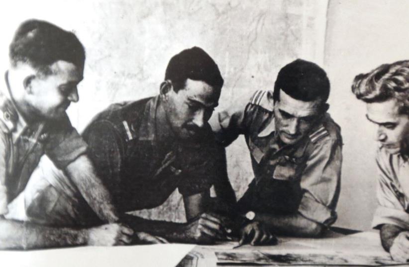 Harold ‘Smoky’ Simon (second left, inset) goes over plans with then-Israel Air Force commander Aharon Remez (left) and two unidentified serviceman during the War of Independence. (photo credit: Courtesy)