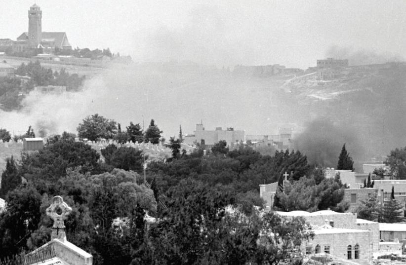 Smoke rises in east Jerusalem during a battle in the Six Day War (photo credit: REUTERS)