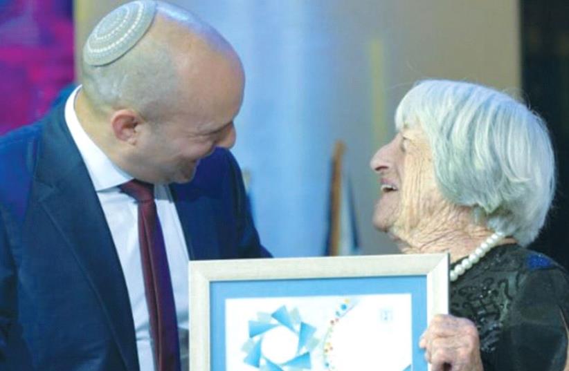 AGNES KELETI receives the Israel Prize from Education Minister Naftali Bennett in Jerusalem (photo credit: SHLOMI AMSALEM)