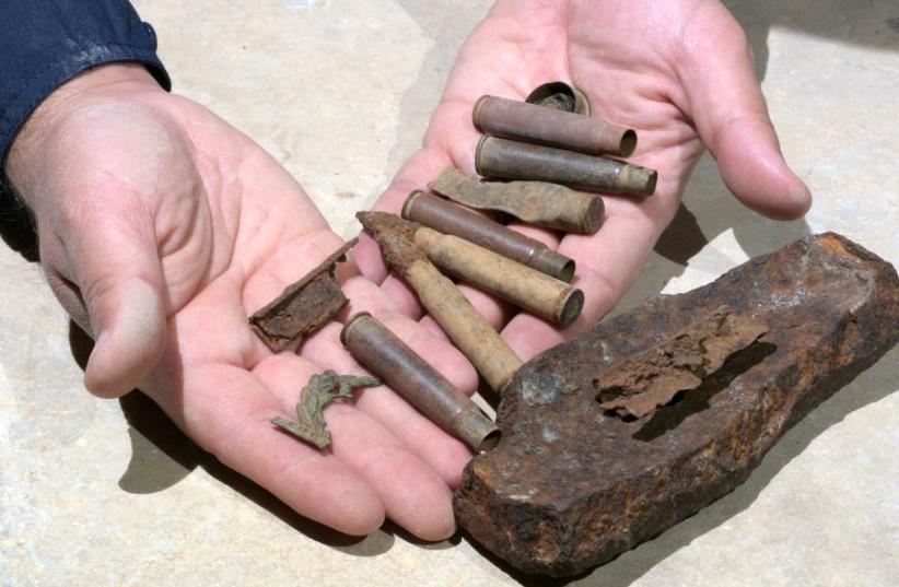 Bullets, cartridges and shell fragments found at the site. (photo credit: CLARA AMIT, COURTESY OF THE ISRAEL ANTIQUITIES AUTHORITY)
