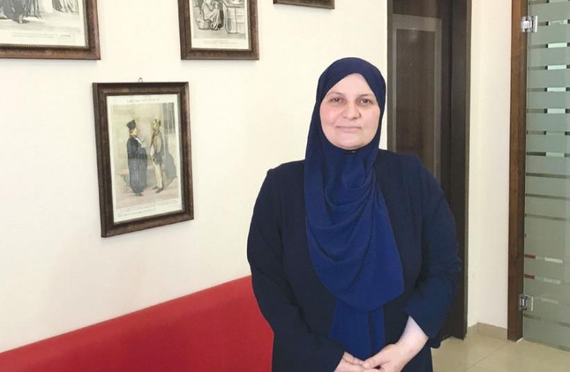 Islamic jurist Hana Mansour-Khatib poses in her office in Tamra, in the eastern Galilee. (photo credit: ELIYAHU KAMISHER)