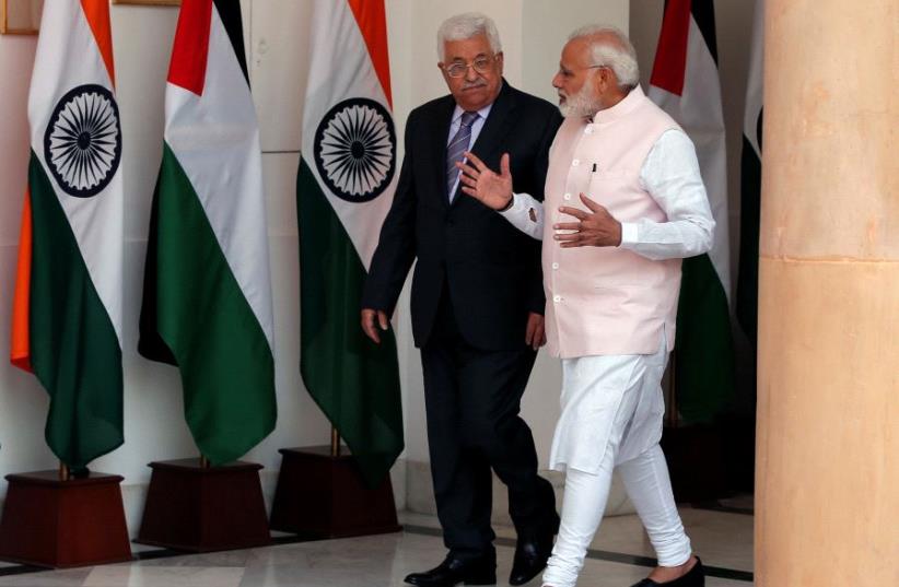 Palestinian Authority President Mahmoud Abbas (L) and India's Prime Minister Narendra Modi arrive for a photo opportunity, ahead of their meeting at Hyderabad House in New Delhi, India May 16, 2017 (photo credit: REUTERS)