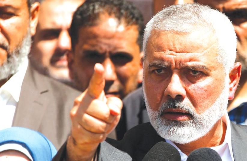 HAMAS LEADER Ismail Haniyeh gestures during a news conference in Gaza City earlier this month (photo credit: REUTERS)