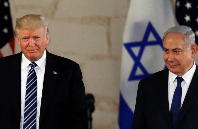 US President Donald Trump stands next to Prime Minister Benjamin Netanyahu before delivering an address at the Israel Museum in Jerusalem May 23, 2017 (photo credit: REUTERS)