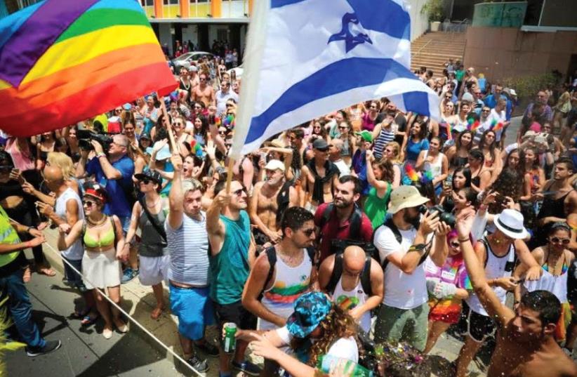 Revelers at Tel Aviv’s 2016 LBGTQ Pride Parade (photo credit: GUY YECHIELI)