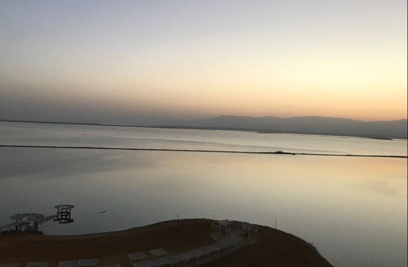 A view of the Dead Sea and Ein Bokek promenade at sunrise (photo credit: SETH J. FRANTZMAN)
