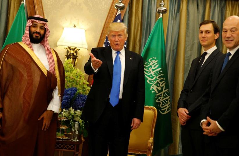 US President Donald Trump, flanked by White House senior advisor Jared Kushner and Saudi Arabia's Deputy Crown Prince and Minister of Defense Mohammed bin Salman at the Ritz Carlton Hotel in Riyadh, Saudi Arabia  (photo credit: JONATHAN ERNST / REUTERS)