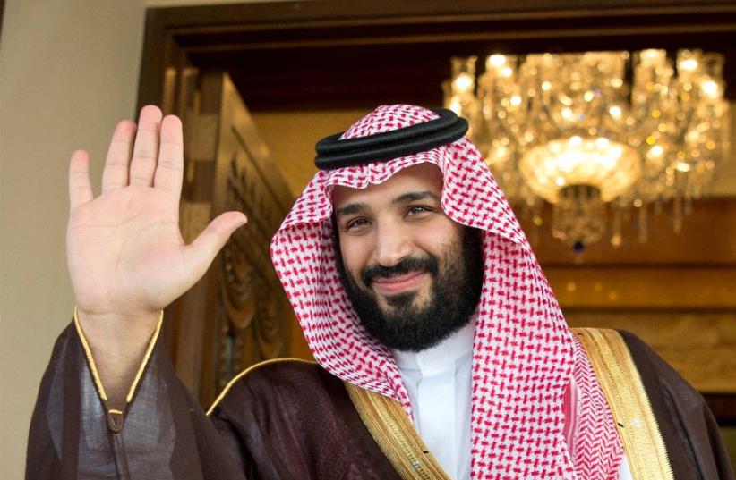 Saudi Deputy Crown Prince Mohammed bin Salman waves (photo credit: BANDAR ALGALOUD/COURTESY OF SAUDI ROYAL COURT/REUTERS)