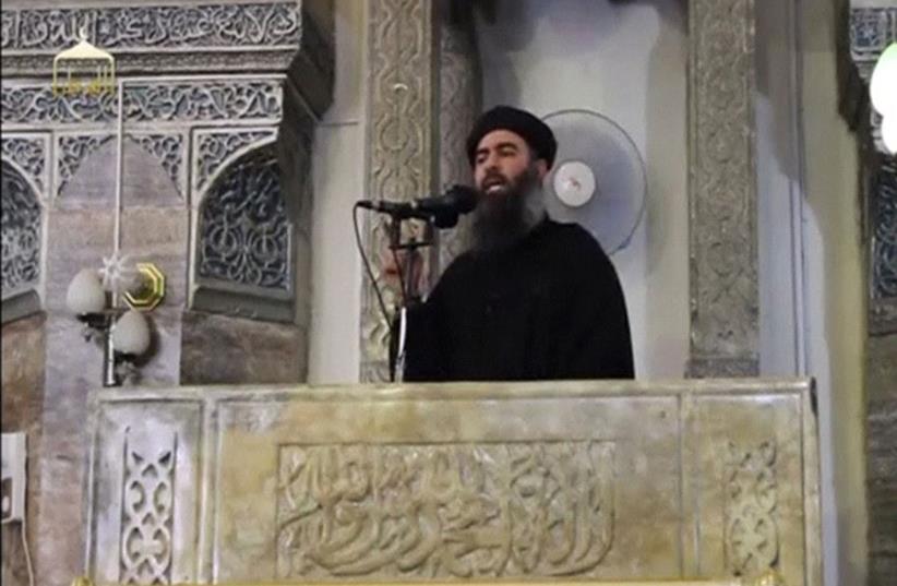  Al-Baghdadi proclaimed himself 'caliph,' or ruler of all Muslims, from the pulpit of the al-Nuri Mosque on July 4, 2014 (photo credit: REUTERS/SOCIAL MEDIA WEBSITE VIA REUTERS TV)