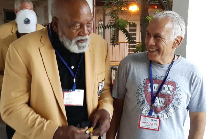 The writer (right) with legendary running back Jim Brown outside Kraft Stadium on June 14 (photo credit: STEVE LINDE)