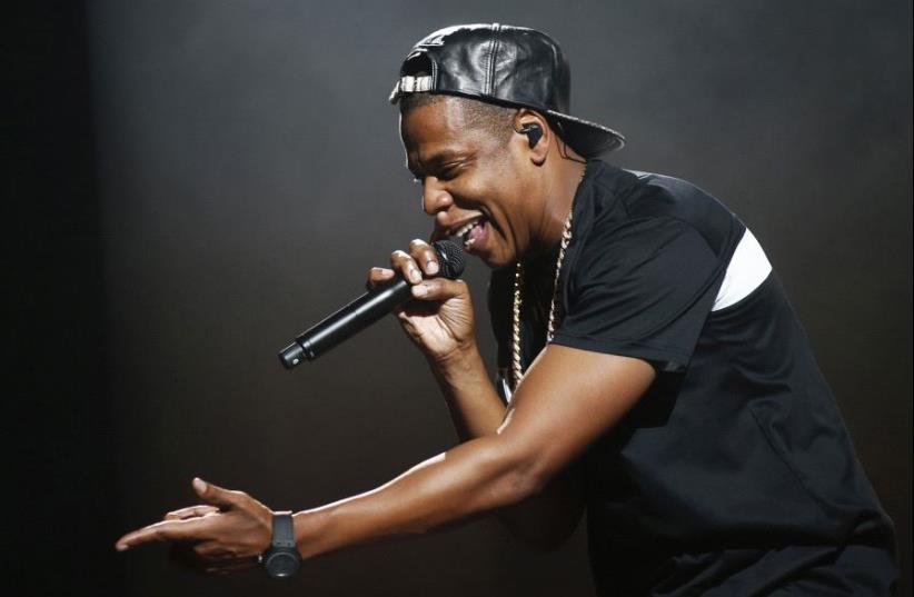 American rapper Jay-Z performs at Bercy stadium in Paris, October 17, 2013. (photo credit: BENOIT TESSIER /REUTERS)