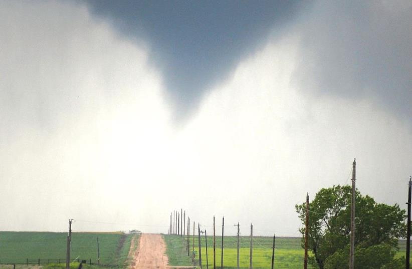 A TORNADO forms over the fields of Kansas. (photo credit: REUTERS)